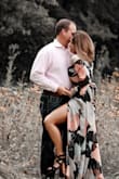 I wore this dress for pictures. Love how it's fitted in the waist. Showed some cleavage, but still tasteful. The slit is a nice detail too. - Melissa M.