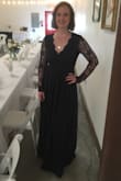 I wore this dress as the maid of honor in my friend's wedding and I received SO many compliments on this dress all night. It was slightly tight on my arms and the sleeves were a little long. It fit perfectly on my waist and so well in the chest area that no bra was needed. The length was perfect as I was wearing 2-inch heels, otherwise, it was dragging on the floor slightly. Overall, this was a wonderful high-quality dress and I would definitely recommend! - Amy W.