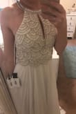 I can't even begin to explain how beautiful this dress it! Fits amazing and the detail is perfect! 
Trust me, worth every cent! - Heather T.