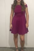 The material is very thick, and the color turned out really nicely. I am usually between a medium and a large because of my super long torso, and I read reviews before that said it ran small so I ordered a large. When it came, it fit fine (if not a little big and pretty long) and was really modest for the event (hoco) as it rode up (and stayed the whole night) higher than expected on the top collar and fell down mid thigh at the bottom. The top flap down was the main downfall for me, it had a tough time staying down in the back and it never seemed to sit right no matter how you folded it. It still looked great and held up in pictures. - Anna W.