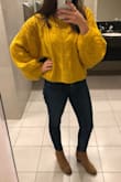 When I first tried this sweater on, I loved it but thought I was going to have to return it because it felt super itchy at first. I ended up keeping it because its so cute, perfect amount of slouch without looking messy, and a great color for the fall.
I've been wearing it for a few hours today and the material hasn't bothered me so I either got used to it or was being dramatic last night- haha.
BTW I don't think I would feel comfortable wearing this without super high waisted jeans, but that's just my preference. - Julia M.