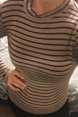 I ordered a large because I don't like my clothes skin tight and so I ordered a large and still too tight for my comfort. The length of the sleeves is way to long on me, covers my fingers, guessing because it's a large. It's a cute shirt though, so I'll keep it. - Amelia T.