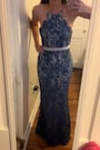 I dyed the cream-colored dress with RIT dye in warm water (which helped it shrink just enough to fit properly). It's super comfortable and flattering! Slightly stretchy, but not tight. Wearing 3-inch heels, I still altered it 4 inches shorter. - Anna K.