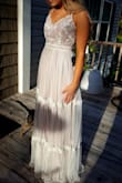 I got this dress to take engagement photos in, but I love it so much that I'm using it as my bridesmaid dress as well! It's unique and BEAUTIFUL! I highly recommend to anyone! It's very flattering. I have a very small upper half, but a big butt and this accentuates my waist while hiding my hips. - Holly K.