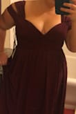 I wanted this dress to fit so badly. It made me feel like a princess. The wine color is gorgeous, and the fabric feels wonderful on your skin. The style is lovely, and it looks incredible in pictures.
That said, it doesn't actually fit, and there are no sizes above XL for me to move to. The empire waist is very, very high, and on my curves, it made it so that my cleavage was not where it was supposed to be, but instead being crushed by the full top part of this dress the bust part, as well as the waist detailing. It wouldn't zipper to the top, although it came close. I tried to convince myself I could wear it anyway, but it hurt my bust after 15 minutes, so I couldn't last a wedding. It's just not a dress designed for large bra sizes if you're also an XL and can't go up a size. It's designed for flatter chests, judging by the tightness of the top area.
I really tried to convince myself that I could make this dress work, through a tailor or something else, but in the end it comes down to the fact that the zipper and waist are so tight that there isn't any room for my bust, and so it would be too uncomfortable to wear for an extended period of time. I recommend shoppers go up a size. If you're an XL with an hourglass and a large bust, maybe you're out of luck. - Leah V.