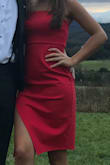 I got this dress in a small. This dress was perfect to wear to a wedding. Slightly baggy in the stomach area, which I was surprised about but overall a good fit. Long enough around, but flirty with the slit. - Taryn J.