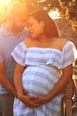 The dress fits perfectly! I bought the dress online to use on my maternity photo shoot, I choose this color because we are having a baby boy. - Elisangela O.