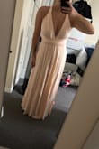 Purchased this as a bridesmaids dress. It fits PERFECTLY! Super stretchy and comfortable, but also holds up a larger bust. Soft fabric, perfect length. Sooo happy with it! - Julie T.