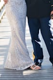 I chose these flats to wear for my wedding reception. I went barefoot for the ceremony, and these were perfect for the beach side deck. They were comfortable and stylish. I love the zipper-back portion of the flats. It makes them look fancier than a sandal. I am typically between an 8-9 in shoes and 8.5 fit perfectly. The price was very reasonable! - Christina B.