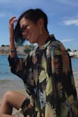 This one is my all time favorite. I wear it both as a beach dress and as a shirt  with a bralette as it is quite see-through. Yes, as many reviewers said it is quite loose but I personally like it, looks more stylish this way. Nice quality. - Elmira D.