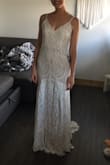 When I ordered this I was hoping it could be a potential wedding dress, but didn't want to get too excited because the price was too good to be true. I figured if I didn't love it I would wear it to my shower. It arrived pretty quickly and the second I tried it on I was obsessed!! It's absolutely beautiful and so well made! This is going to be my wedding dress! I ordered size small because I didn't want to risk it being too small. It is a tiny bit big around my waist so I will have it altered before my wedding day to fit me perfectly and add a deeper V in the back. The lace detail is absolutely gorgeous and it is fully lined. I love the small train and the detail around the bottom.  I'm so happy with this purchase and I saved a fortune!!! Thank you lulus! You rock!! - Shelby I.