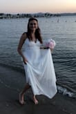 This dress was perfect for a warm beach wedding. It was flowy and long but I still felt cool and comfortable. I fell in love with it the second I put it on. I had to have it taken in a little in the bust but other than that it was perfect. - Amy H.