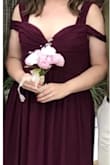 This dress truly is beautiful. I love the color and the style. Plus, it's very affordable! My only complaint is that I'm not sure if the measurements on the website are 100% accurate. I found the dress to run a tad larger than what I was expecting. The straps on my shoulder fell off frequently through out the wedding I was in. Also, this dress is super long. I am on the short side, so I had to get my dress hemmed. But even with heels on and alterations, I still found myself stepping on the dress at times. That was even after having nearly 3 inches cut off! So if you're short, be prepared to have this dress altered. Overall, I have no regrets getting this dress. - Shelbie P.