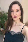 This top fits perfectly and looks just as nice in person. It's a bit of a darker green than in the photos. It's definitely a sexy yet classy top! - Audrey T.