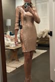 Love this dress. Fits true to size. Really sexy. I'll be wearing it to NYE. - Leslie B.