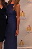 I ordered this dress on a Monday with 3 day shipping and it arrived in time for my event on Saturday. I love it! It's form fitting and I received a lot of compliments on it. I ordered a size medium. It's very long but I held it up when I walked. I didn't have time to hem it but I would recommend getting it hemmed if you have the time. Great quality and I'll be able to keep this on hand for future events. - Brianna H.