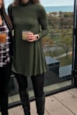 This dress is so cute! I'm very tall so a big thing for me is the length of the dress and I thought this was perfect! It was just slightly longer in the back (not very noticeable but just slight) so it was great for keeping my behind covered. I paired it with tights and boots and wore it out this weekend and got lots of compliments. The material is soft and stretchy and the collar was great. A little snug at the top (and I have a smaller chest) so definitely consider this when you get it. - Hailey T.