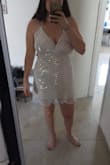 It didn't fit the occasion (a bit short and not good for dancing a lot). But fit really well, and is a good quality. Ordered also L which was a bit tighter to the body and a bit shorter. - Dana S.