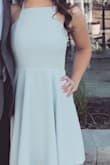 The fabric was perfect. Wore it to an outdoor summer wedding and it never wrinkled or flew up from a breeze. I had to adjust the straps myself but other than that it fit perfectly. - Sierra B.