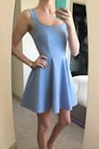 This dress is so flirty and fun. The blue is so pretty. I have received so many compliments on this. The material is very unique it holds the shape of the bottom and is very comfortable! A must have! - Sandy N.