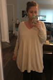 Due to the reviews and pictures, this sweater seemed perfect. I'm usually a medium/large but I ordered the small/medium due to it running big. This sweater doesn't run big, it runs huge. I mean I'm pregnant and not a small person, and I am swimming in it. It is very soft and comfortable which is the only reason for 3 stars. I'm hoping to exchange for the XS but they are out of the beige color until December. - Erin W.