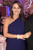 Material was comfortable and loved the cross shoulder, side cleavage showed a lot, wore a little loose, I would have purchased a sized smaller. Length is elegant complemented well. - Stephanie D.