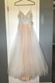 Ordered this dress for my wedding next fall. The cups in the bust area  aren't as noticeable in person. Great material! Absolutely love it and can't wait to wear it. - Samantha R.