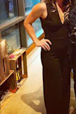 I ordered this jumpsuit for a wedding I was both attending and filming (part of). When asked to film just a couple of weeks before the wedding, I realized I needed to now where something both functional but that would still allow me to have a little fun - and this was IT! I was weary about ordering as I have never worn a jumpsuit before and do have some confidence issues with my lower waist region - especially since I am short and have a shorter waist. I wish they made these jumpsuits in petite sizes because I had to get quite a bit hemmed, and there was a tiny bit of flaring out at the waist - but the number of compliments I received gave me so much confidence that I will certainly order other jumpsuits in the future. I am small chested but it still sat comfortably on my chest, and fell nicely on the region I was anxious about (it didn't squeeze above the "love handles" and that's what I was worried might happen). I'll try to post other photo's if I can find them, but here's one taken from the night (low lit but it's the best I have). My only other wish was that it had pockets - it would have been beyond perfect then! - Brynn Z.
