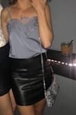 I got this shirt in grey and wore it with a black leather skirt. It's a really pretty top!! I was able to wear it without a bra because I have a small chest and the lace concealed the chest area. Can't wait to try it with some dark jeans. - Naomi A.