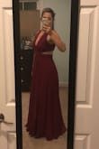 This dress is amazing. I worried it would be too much skin but I found it to be just the right amount. The neckline is definitely deep, but the upper back is covered enough that I think it balances the side/back cut out. I found it to be very flattering and got so many compliments. The skirt is very full and flowy, and while I was skeptical of other reviews stating you didn't need a bra, I was pleasantly surprised to find out they were right! I bought the plum color and it was the perfect jewel tone. Thrilled with this dress and can't wait to wear it again! - Stefani M.