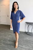 I loved this dress. It's great because it can be dressed up or down. I have kind of a wider frame, longer torso, and the medium fit perfectly. I got so many compliments and the blue color was such a hit! - Regina C.