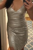 Love the dress. The gathered front area is forgiving & helps cover if you have a little stomach to hide.  :) Overall, it fits nice & a sexy dress! - Olive G.
