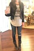 I ordered this because I did not have a black leather jacket of any kind and had been wanting one. I love the stylistic details in this one- the stitching, zippers and such. The cut is flattering while still edgy, which I like. I do wish the sleeves were a little less tight. It's not super comfortable when I bend my arms and I do not have large arms by any means. You might want to size up! - Cassidy O.