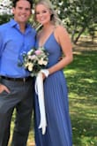 I took this dress out of the box and didn't have to change a thing about it. It fit like a glove. I wore this as a bridesmaid dress with short heels about 1-1.5 inches. It barely grazed the ground. The pleats made it so you didn't have to worry about it wrinkling and it's very flattering. Would definitely recommend! - Jordan R.