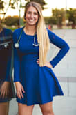 I purchased this dress for a graduation photo shoot and love it! The blue is a beautiful, vibrant royal and the quality of the material is fantastic! It will be great to continue to use as it gets colder because the fabric is actually relatively thick. The dress hugged my shape perfectly and hung comfortably to my mid-thigh region. Would definitely recommend! - Katelyn J.