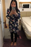 In the pic, I weigh around 128lbs. But 3 weeks ago I was 132lbs, I still fit in that dress size S. I wore that dress in New York City, the weather was windy & cold, so I wore a thin blouse under the dress, and I still look good. The dress does run a little large for size S, and the neck is wide (if I bend down too much, it shows my bra).  It is wrap dress, very easy to wear :) - Annie D.