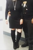 I could've bought a medium for a tighter fit but I love the looseness in the large. Very form fitting and cute. Pairs great with tall boots. Wore the dress to a 60th birthday party and received a lot of compliments. Definitely was a great buy! - Ajene N.