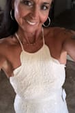 The dress fits like a glove! It's a beautiful dress that will reveal your curves flat tummy and tiny waste. - Lisa M.