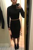 The material is thick but I didn't find it scratchy or uncomfortable. I sized up but think a small would've looked better, but not enough for me to exchange it. I have a lot more room around the shoulders and arms. Overall I still think it's flattering. - Taylor J.