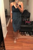 I think it fits really cute, but it does git my knees and is a little too modest for my taste. Not worth hemming either, so think I will return it. Very nice color though, and the top is flattering! - RaeAna E.