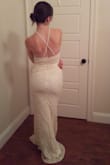 This dress is beautiful and exactly as described. It's a bit confusing to put on with the criss-cross straps; but lovely once on. Only problem is that the scallops on the front like to curl up. P.S. I did not have shoes on in the photos; will be more reasonable on length with heels. - Kim H.