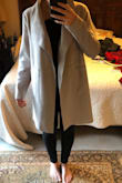 I wanted this to fit so bad, and I ordered the last medium. Unfortunately the reviews were right, it does run big. I'm a true medium at Lulus, and I need a small. Update: I managed to snag a small size, but it still didn't fit right (pictured). The small fit in the arms and shoulders, but the way the coat hangs is too wide for me. It's not tailored enough for my liking. It is amazingly soft though and the color is beautiful. - Mikyla M.