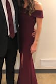 This dress is super cute and flattering! I ordered it in burgundy for a sorority formal and it looked amazing! I am 5'4" weigh 115 and the XS fit perfectly! I had to wear 4 inch heels so it didn't touch the ground. Overall very comfortable and great looking dress! - Stacy T.