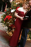 Medium weight material, lovely burgundy color, rubber on the shoulders and bra area to hold onto the skin, and stiff plastic to keep the v shape of the top. I loved this dress for the Marine Corps Ball!! I did have to get it hemmed but I loved it! Would highly recommend. It also travel well with almost no wrinkles after being in a suitcase. - Shauna C.
