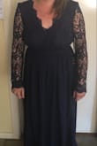 Dress fits great! The sleeves are a little loose but it's not to loose that it's noticeable. Comes in tight at the waist but that means you don't need to wear a bra which is also great. Runs small so I would size up for sure. - Hannah C.
