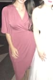 I bought this dress to wear to a wedding and am so glad I did! It fits great and was extremely comfortable. There are some other reviews that commented that the top was too revealing but I did not experience this at all. Not the best picture but will post a better one once the wedding photos are ready. - Liz N.