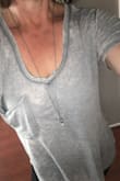 I ordered two of the Pleasant Surprise tees - one in black & one in mauve. They both fit, although the mauve one was almost a size smaller even though both were sized as Medium. I gave away the smaller one and ordered two more shirts in large so I could have them oversized. I love how both sizes fit, and wear them all the time. I would say that they actually fit true to size, so you should order based on the look you're going for. If you want to knot or tuck the shirt, go a little bigger. The v-neckline is perfectly set in either option. Super feminine & I totally recommend. - Deborah C.