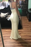 I bought this dress in size small. When I received it, I knew it would need to be hemmed before my wedding. We took about 4 inches off, otherwise it fit perfectly everywhere else. It was such great quality and I got so many compliments. Also, this dress has two skirts under the lace. My wedding was in November on 40 degree weather day. I was okay taking outdoor photos in this dress. Overall it is beautiful and for such a great price! Also, the photos I am sharing are right after the hemming and with no heals. - Ariel S.