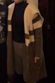 This cardigan is thick and super cozy! It runs a little big but it's perfect for cuddling up in at home or wearing it as outerwear on a 50 degree day. Only complaint is it can be a little itchy on your bare skin if you tend to run on the sensitive side. - Claudia M.