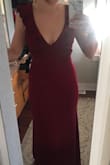 Ugh I can't say enough good things about this dress. I feel absolutely beautiful in it and it's also very comfortable. If you're on the fence just GET IT. The color and cut are both gorgeous. A little chesty but hey its NYE, time to let the girls live a little eh? The material of this dress is the same as the Lulu's Infinite Glory dress I purchased earlier this year for another black tie wedding. The material is slightly thicker and has a weighted feel to it so it's very forgiving and comfortable. But just know it is LONG. I'm on my tippy toes in both of those pictures- but nothing a little hemming tap and an iron cant fix. - Samantha M.